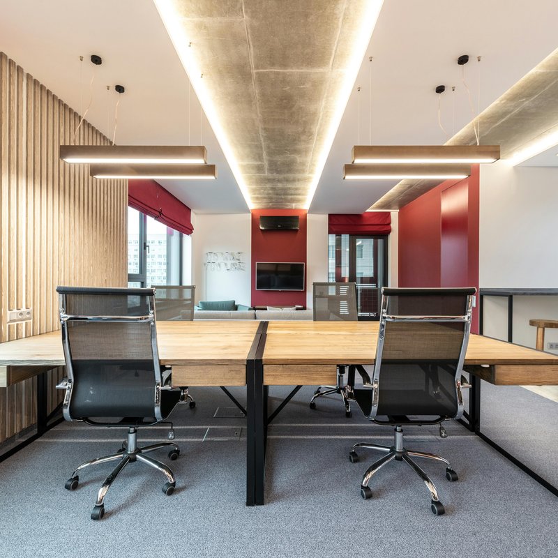 Smart flooring with embedded LED lighting and foot traffic sensors in modern commercial space.
